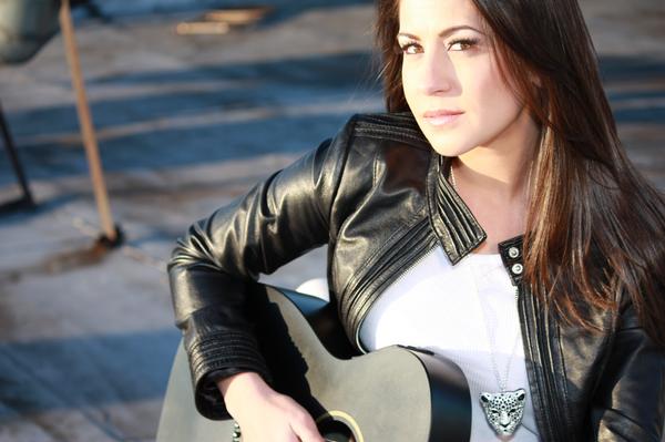 Christine Vaskas with her guitar
